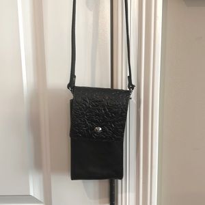 Cell phone all leather crossbody mint condition. Four inches by 7 inches